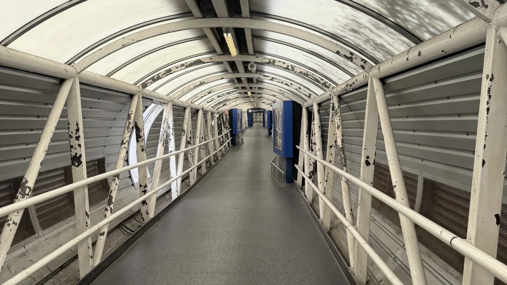 Covered walkway connecting Hilton London Heathrow Terminal 4 to the terminal