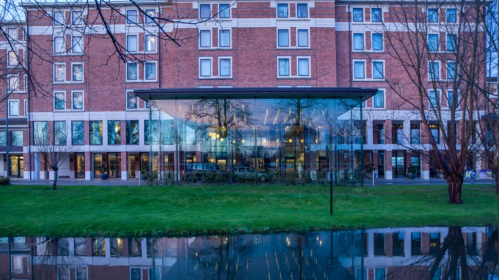 Hilton London Heathrow Airport Terminal 5 exterior with reflecting pool