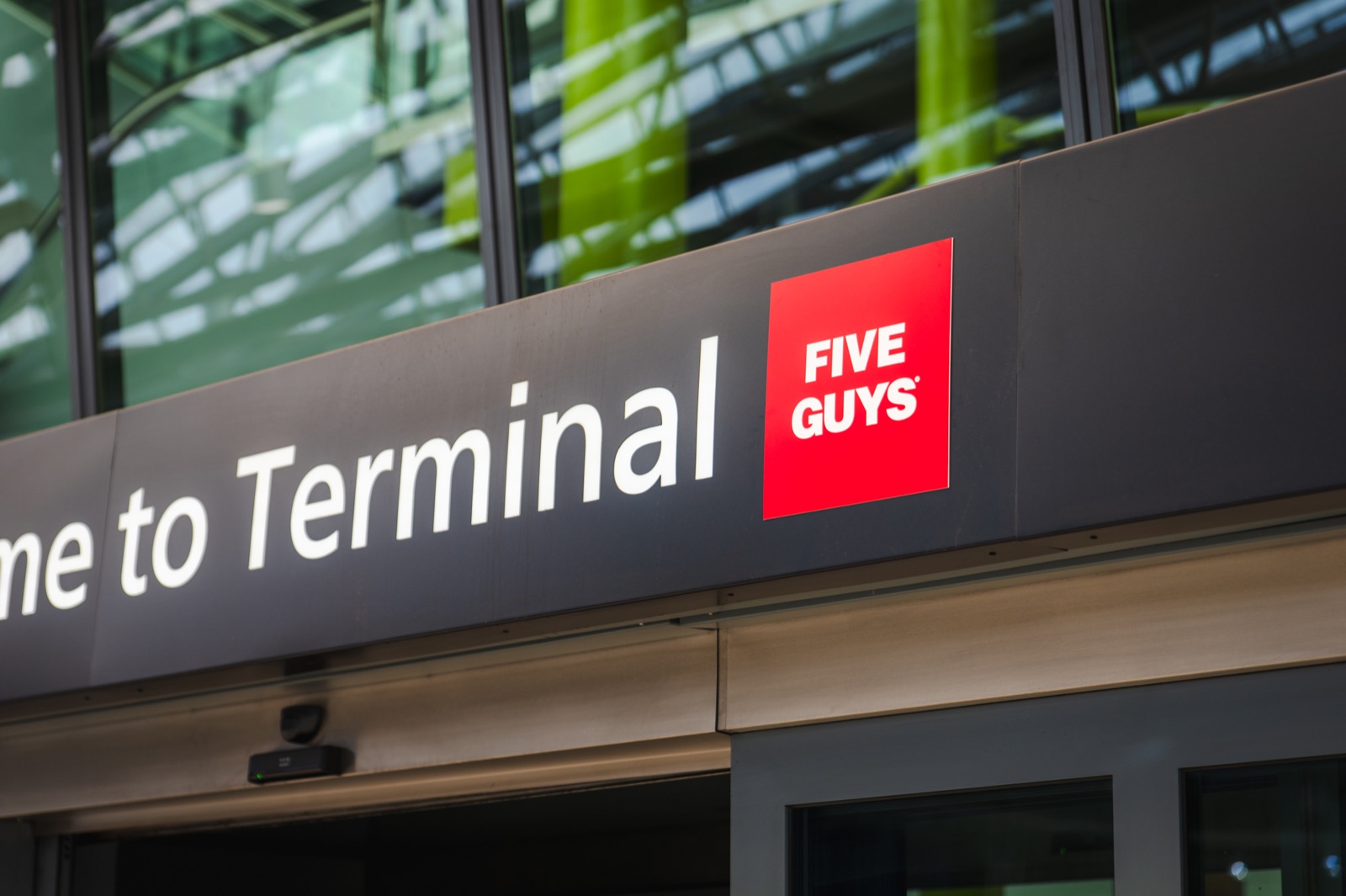 Five Guys sign at the Heathrow Terminal 5 entrance