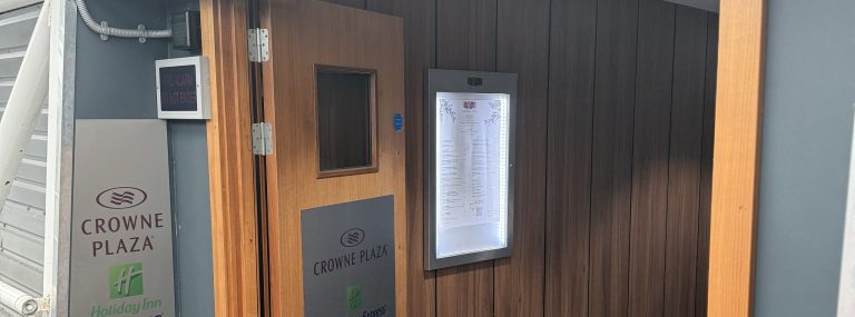 The entrance to the Crowne Plaza Heathrow Terminal 4, with the Crowne Plaza sign