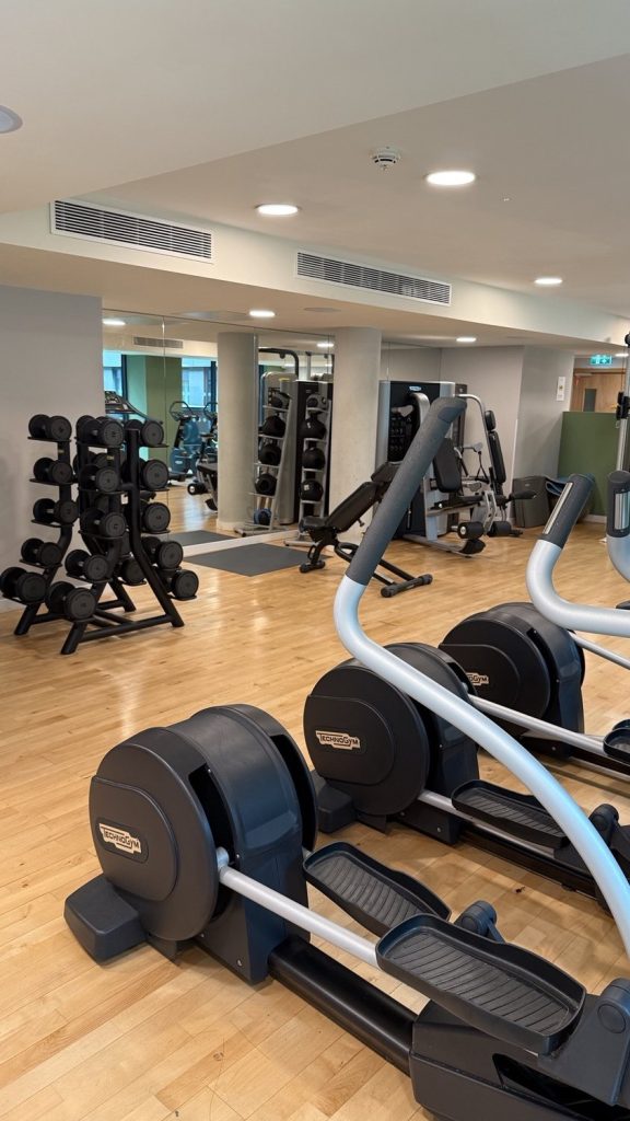 The gym, with cross trainers and free weights