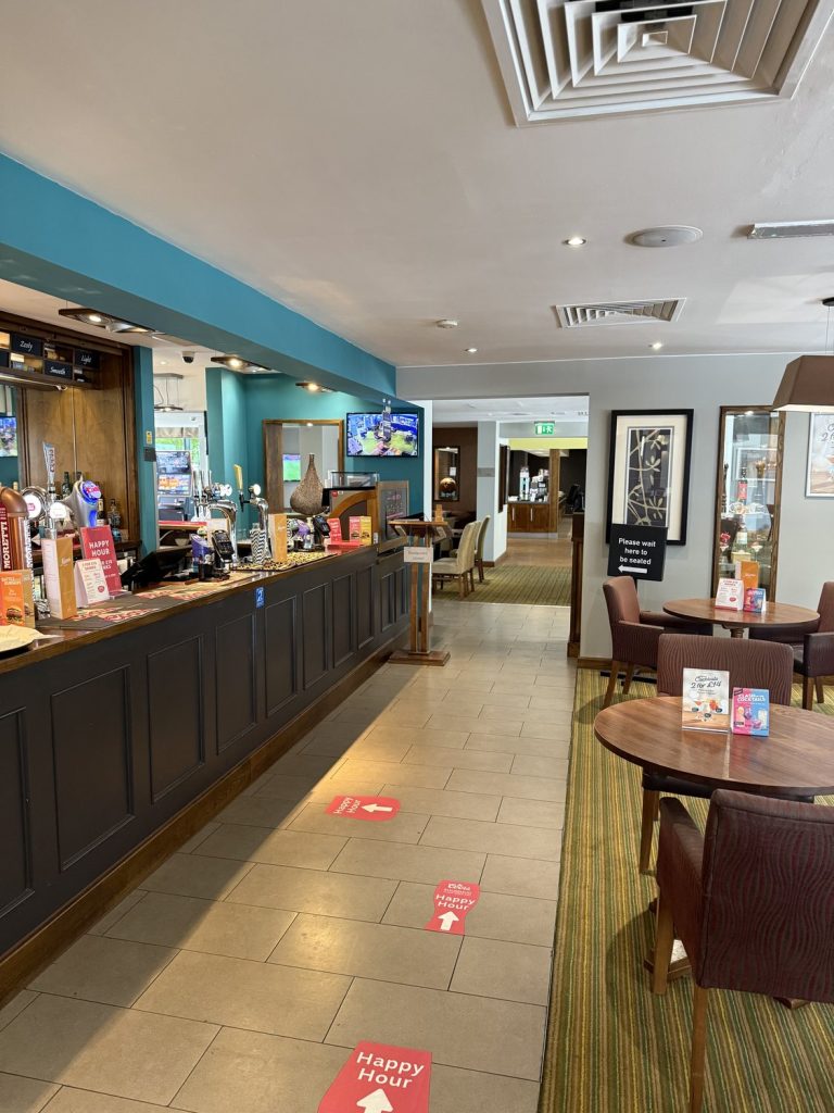 The bar and reception counter inside the Premier Inn