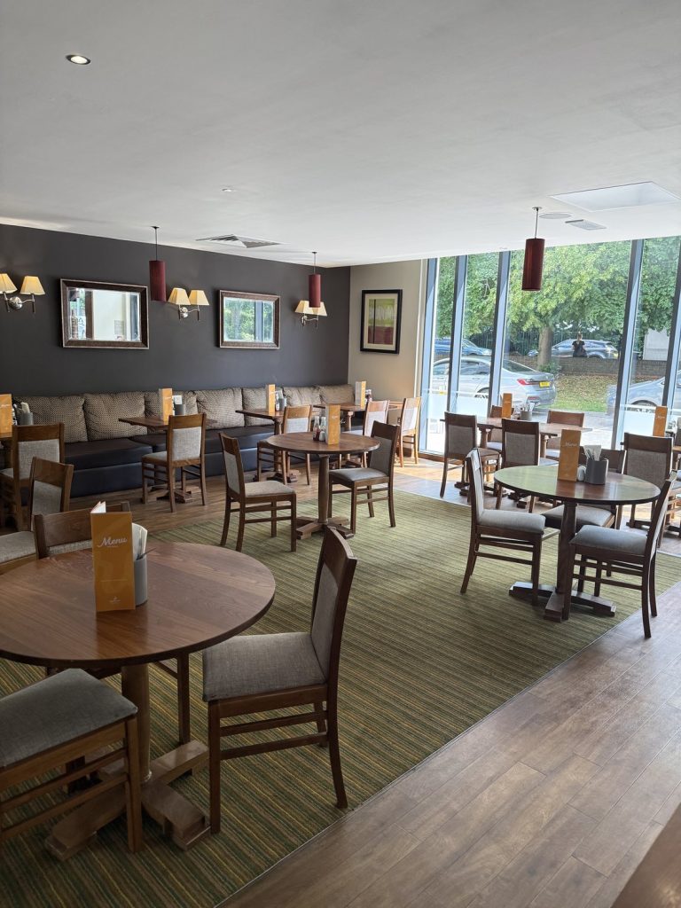 The Thyme restaurant, with tables set beside the windows