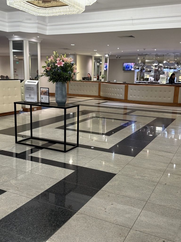 The lobby at the Renaissance Heathrow, looking across the marble floor to the reception desk