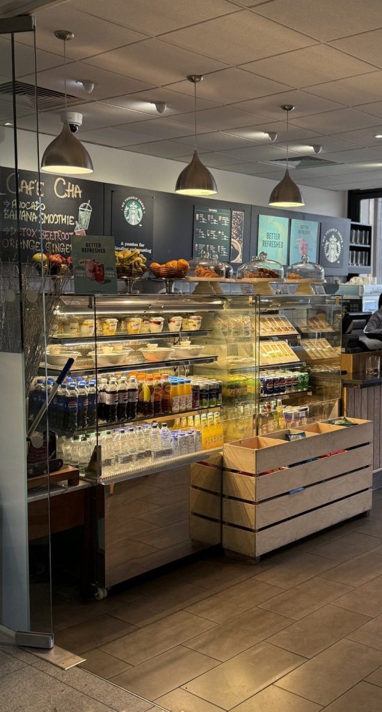 The Cafe Cha counter at the Renaissance Heathrow, with a chilled display of drinks and food