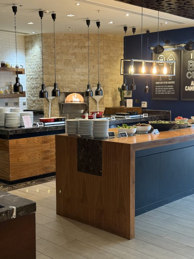 The Cast Iron deli counter, with pendant lights over the servery