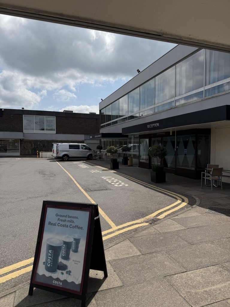 The hotel frontage and glass-fronted upper floor at the reception entrance